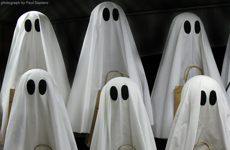 6 people with bed cloths on their head made to look like ghosts